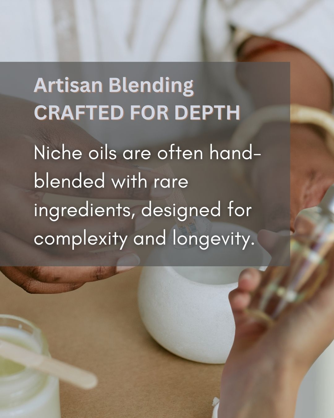 Person holding a bottle with text about artisanal blending and niche oils.