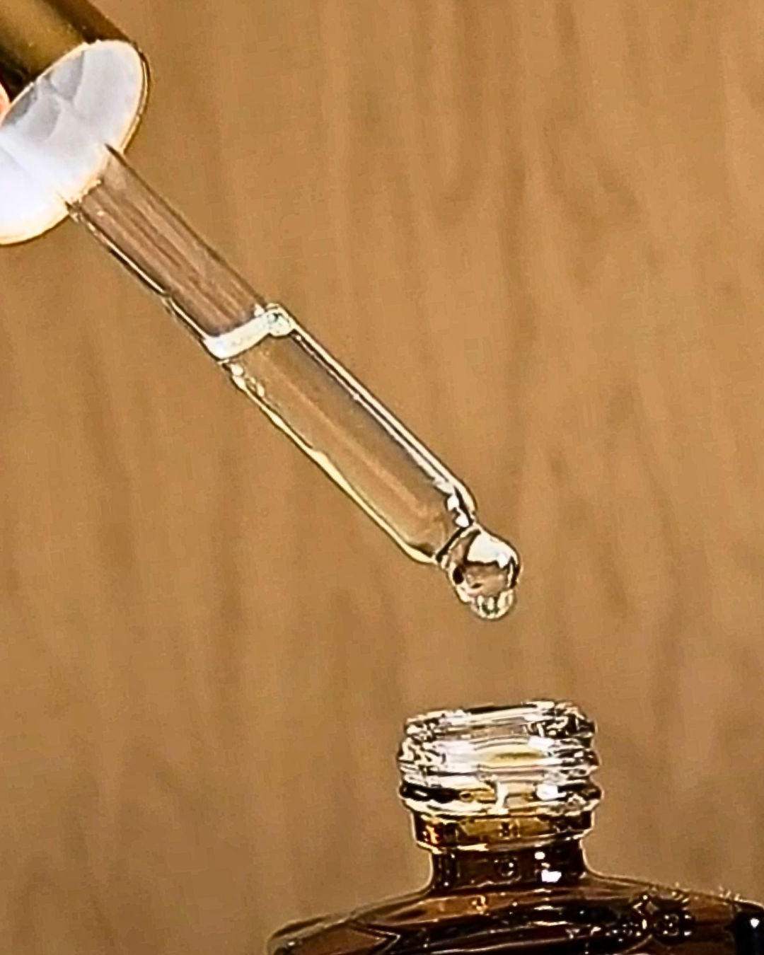 Perfume Oil dropper over top of brown bottle | The Nothern