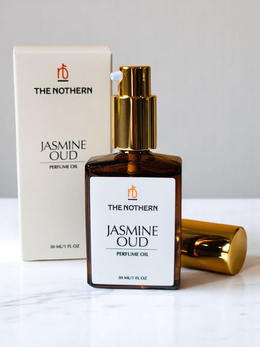 Jasmine Oud Perfume Oil with a pump top, next to its packaging box. The box and bottle have white backgrounds with text and branding | The Nothern