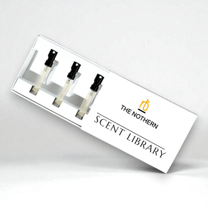 Four perfume bottles in a display case with 'The Northern Scent Library' branding on a white background.